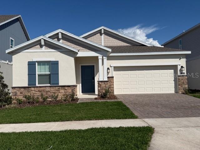 a front view of a house with a small yard