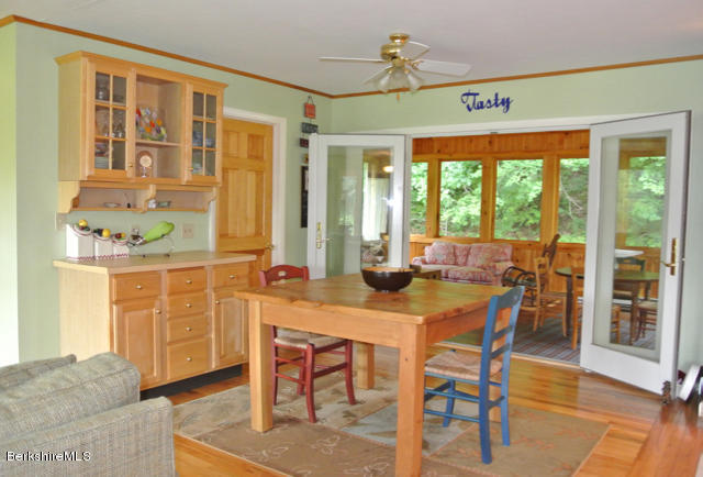DINING OPENS TO SUN ROOM