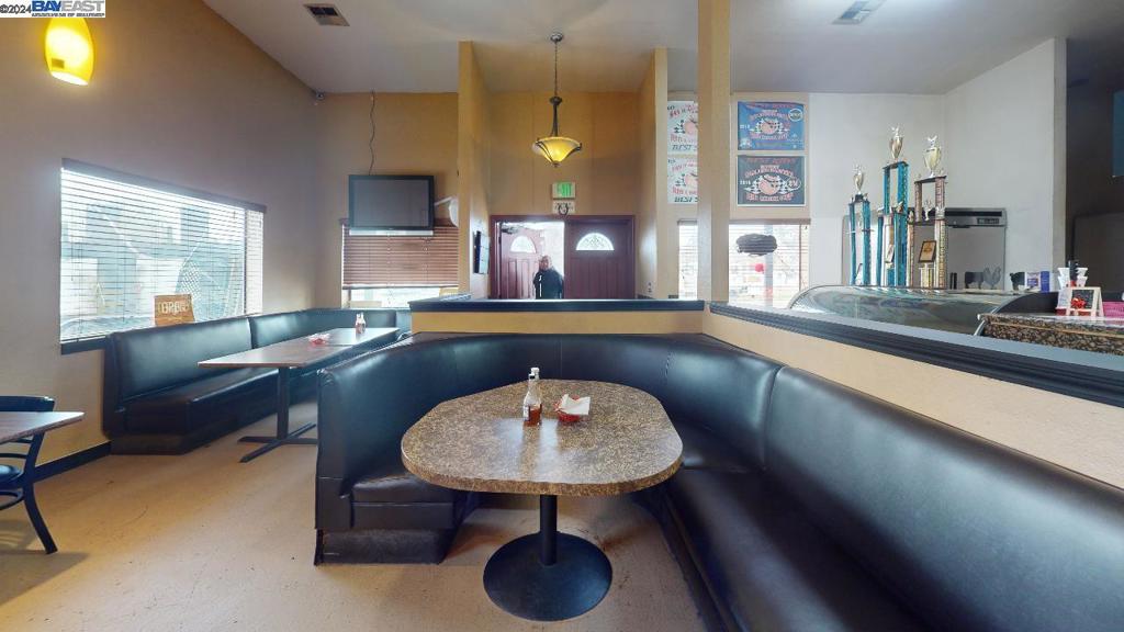 421 Maze Boulevard Modesto, CA 95351 - Photo 11 of 30 a living room with furniture and a chandelier