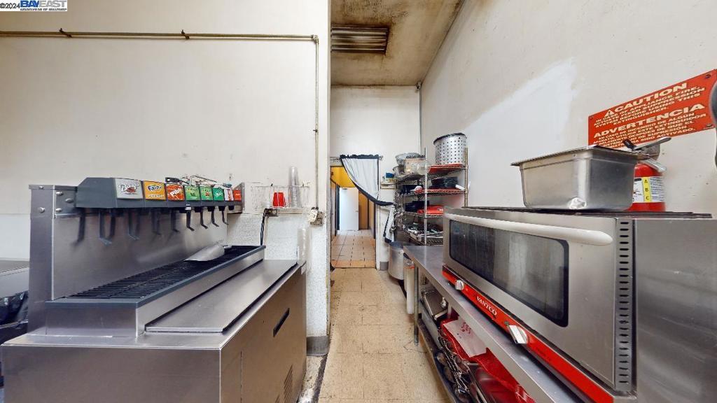 421 Maze Boulevard Modesto, CA 95351 - Photo 19 of 30 a room with furniture and a book shelf