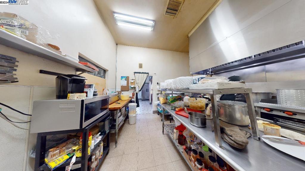 421 Maze Boulevard Modesto, CA 95351 - Photo 20 of 30 a storage room with washer and dryer