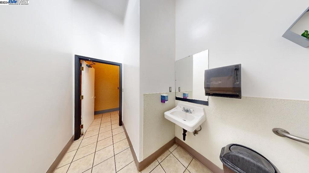421 Maze Boulevard Modesto, CA 95351 - Photo 23 of 30 a view of a livingroom with furniture and a flat screen tv
