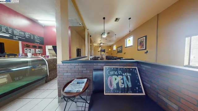 a large kitchen with a table and chairs