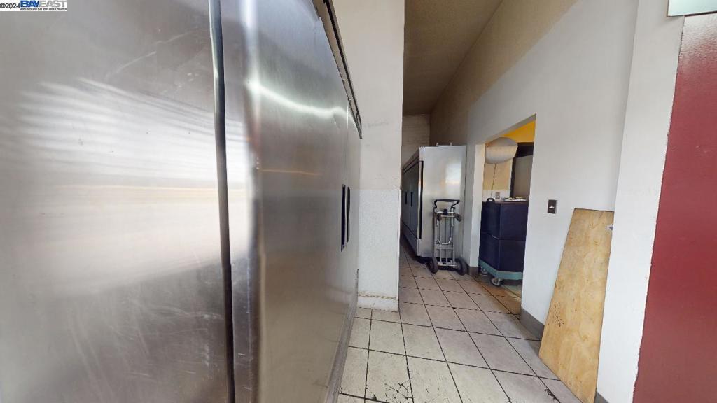 421 Maze Boulevard Modesto, CA 95351 - Photo 27 of 30 a view of a hallway with wooden floor