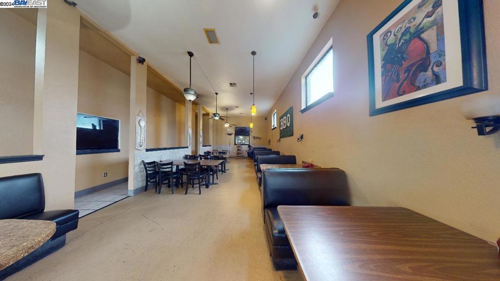 421 Maze Boulevard Modesto, CA 95351 - Photo 30 of 30 a view of a livingroom with furniture and a flat screen tv