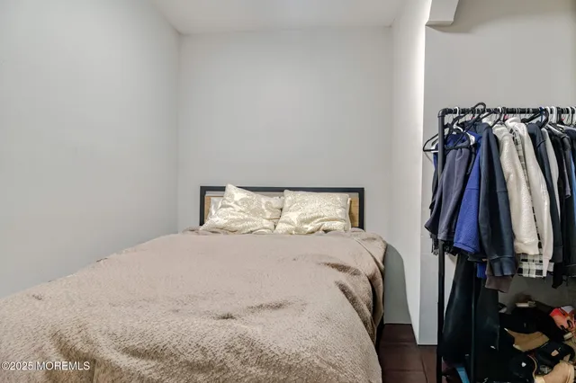a bed room with a bed and a walk in closet