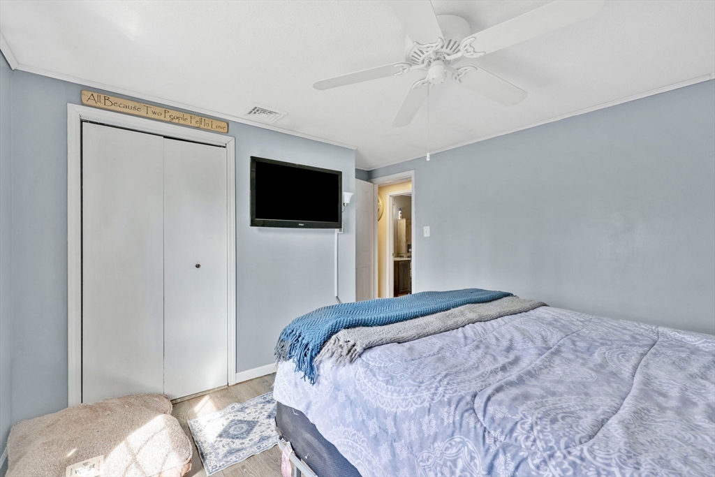 295 Burlingame Road Palmer, MA 01069 - Photo 22 of 31 a bedroom with a bed and a flat screen tv
