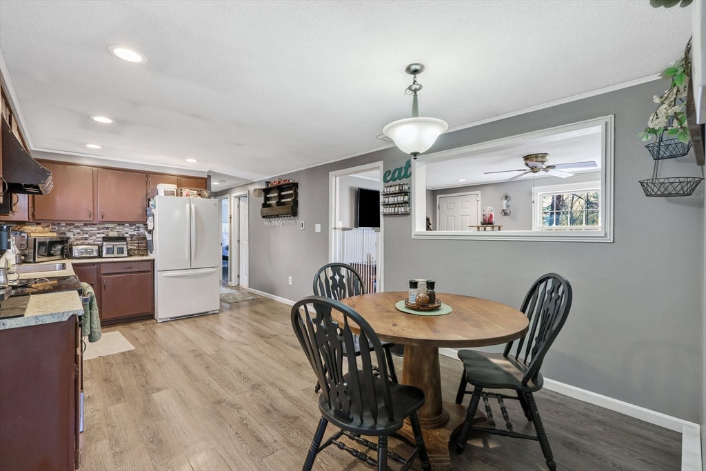295 Burlingame Road Palmer, MA 01069 - Photo 7 of 31 a view of a dining room with furniture wooden floor and chandelier