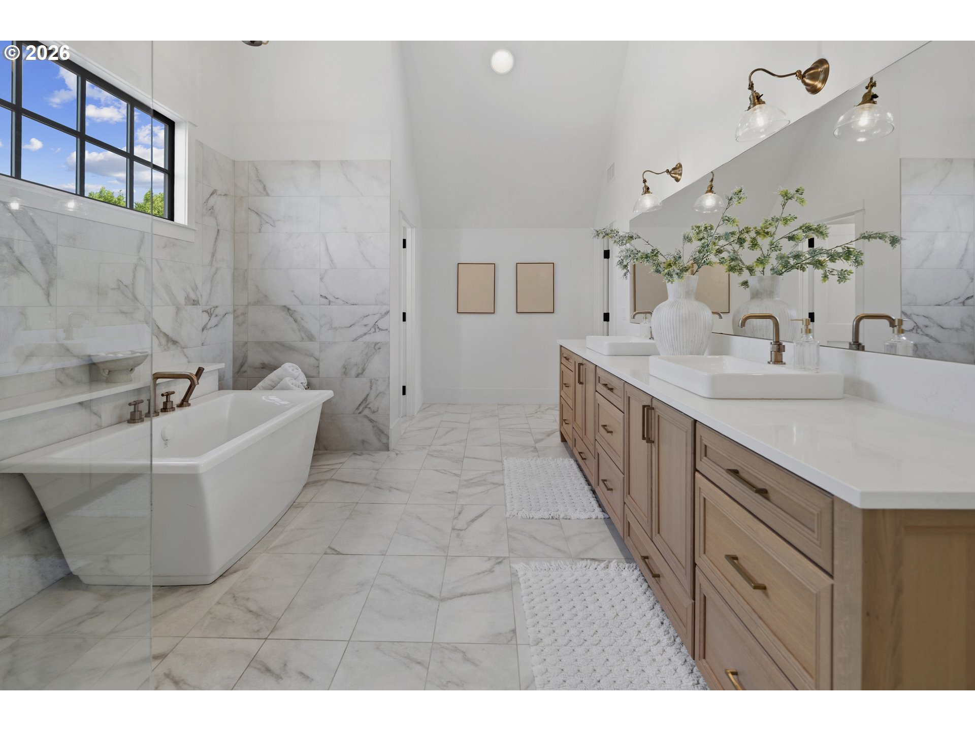 554 Northwest Dawson Ridge Drive Camas, WA 98607 - Photo 19 of 48 a spacious bathroom with a double vanity sink a mirror and a bathtub