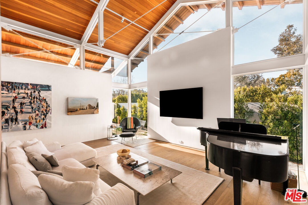6728 Wildlife Road Malibu, CA 90265 - Photo 9 of 57 a living room with furniture and a flat screen tv