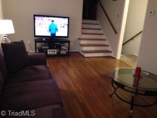Steps lead to upper level bedrooms
