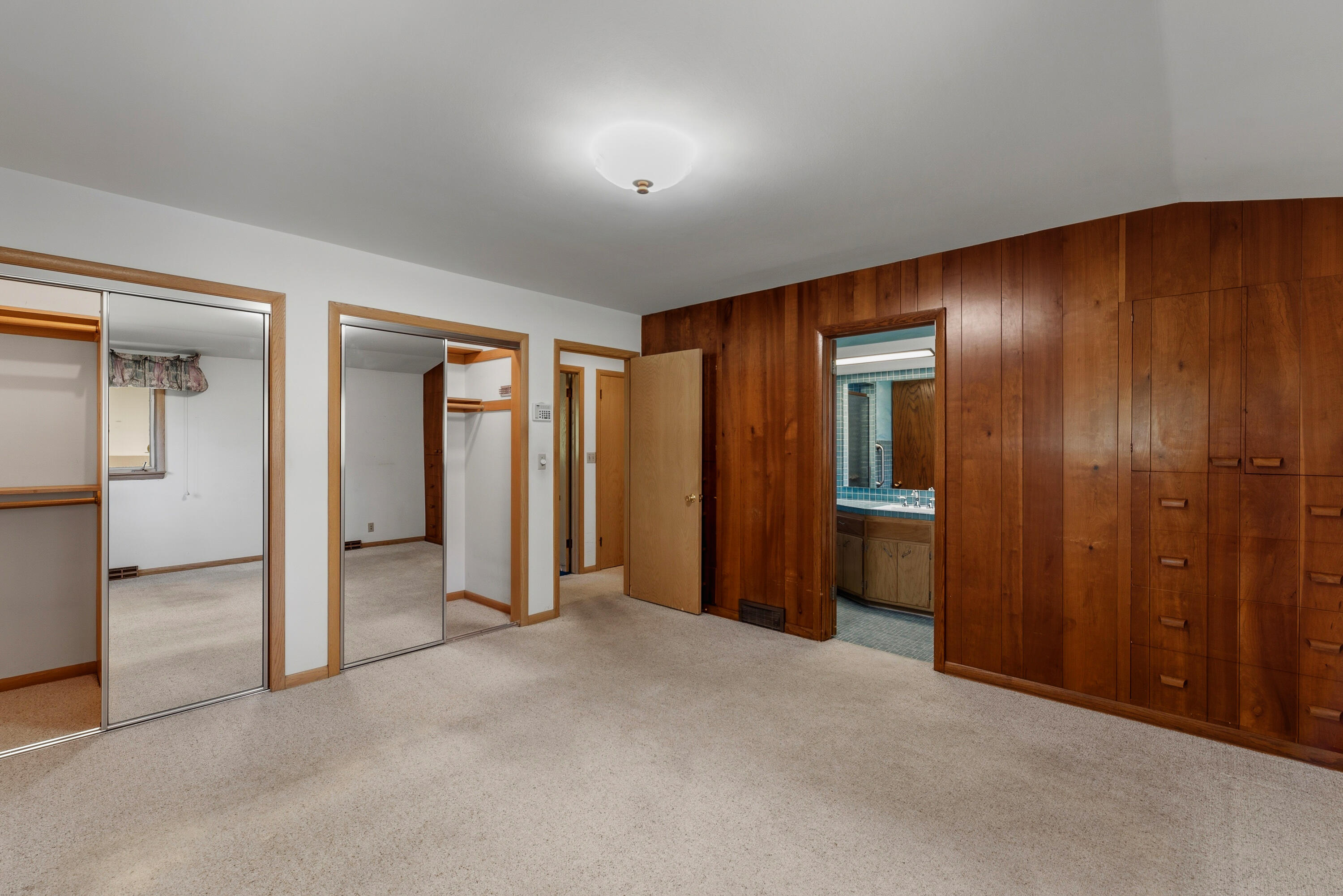 8909 North Maitland Road Bayside, WI 53217 - Photo 20 of 40 double closet. view to bath.