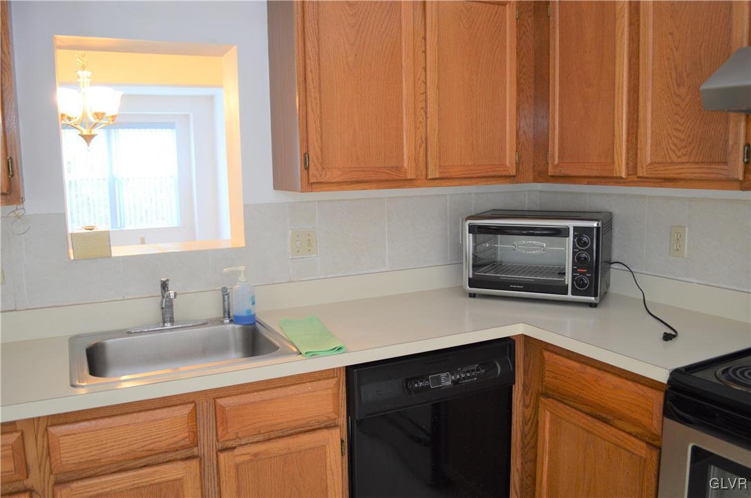 308 Mickley Road Whitehall, PA 18052 - Photo 16 of 43 a kitchen with stainless steel appliances granite countertop white cabinets sink and dishwasher