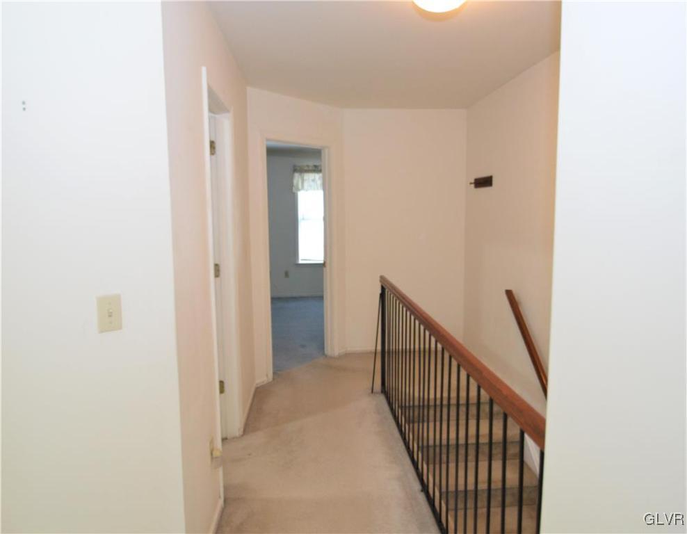 308 Mickley Road Whitehall, PA 18052 - Photo 27 of 43 a view of a hallway with wooden floor and entryway