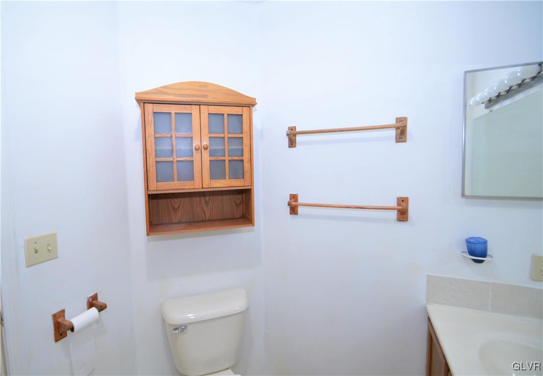 308 Mickley Road Whitehall, PA 18052 - Photo 28 of 43 a bathroom with a granite countertop sink a toilet and a shower