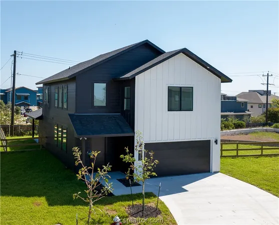 a front view of house with yard street and outdoor seating