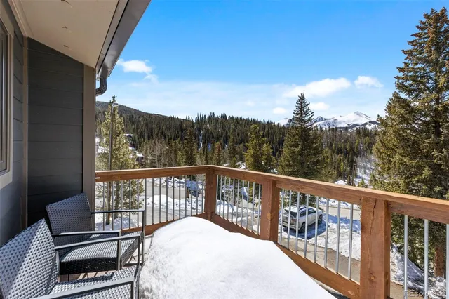 a view of a balcony with wooden floor