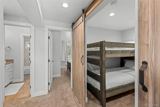 a bedroom with a bed and a view of bathroom