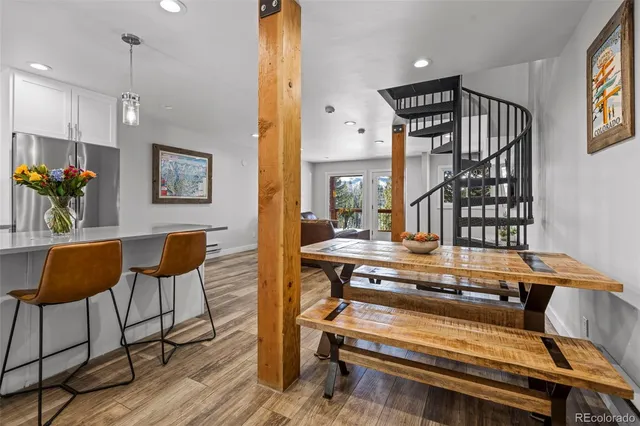 a view of workspace with wooden floor and furniture