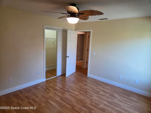 a bathroom with a shower and mirror