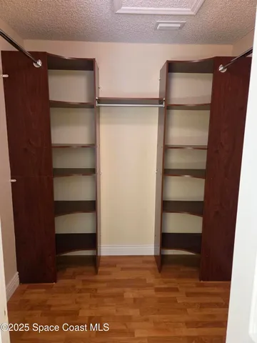 a view of a pathway with a garden