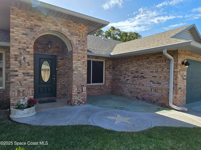 a view of a house with a garden