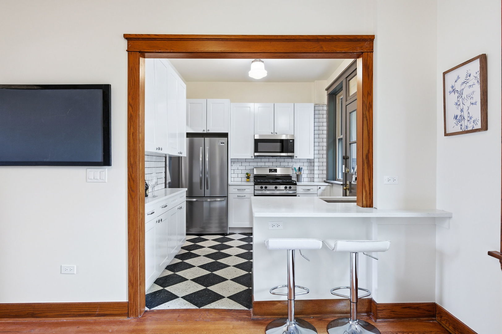 2920 West Altgeld Street, Unit 2 Chicago, IL 60647 - Photo 8 of 22 a kitchen with stainless steel appliances a refrigerator and microwave