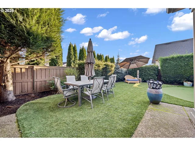 a view of a backyard with furniture