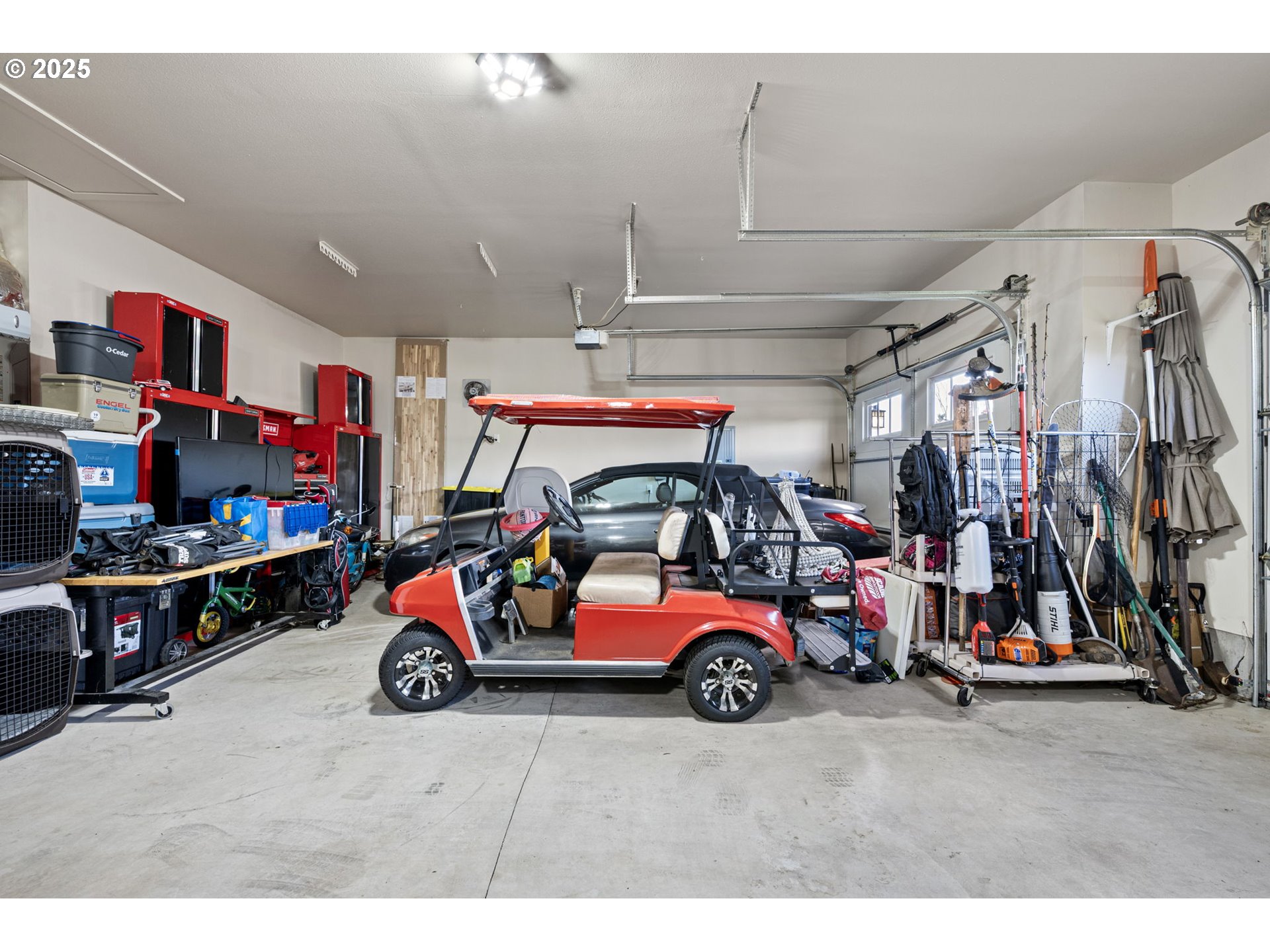 1765 Trevino Road Creswell, OR 97426 - Photo 15 of 26 a view of parking garage with cars and other equipment