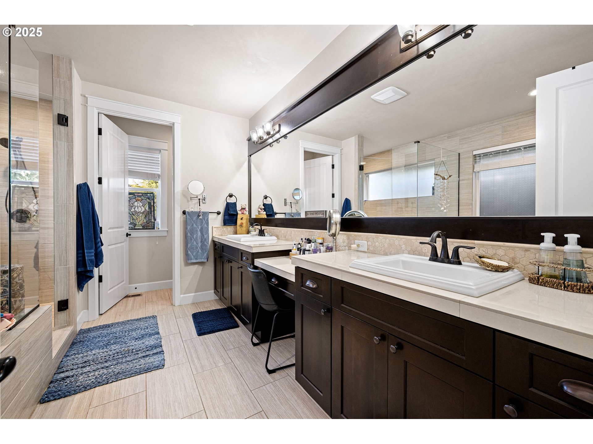 1765 Trevino Road Creswell, OR 97426 - Photo 21 of 26 a en suite bathroom with a sink double vanity granite and a mirror