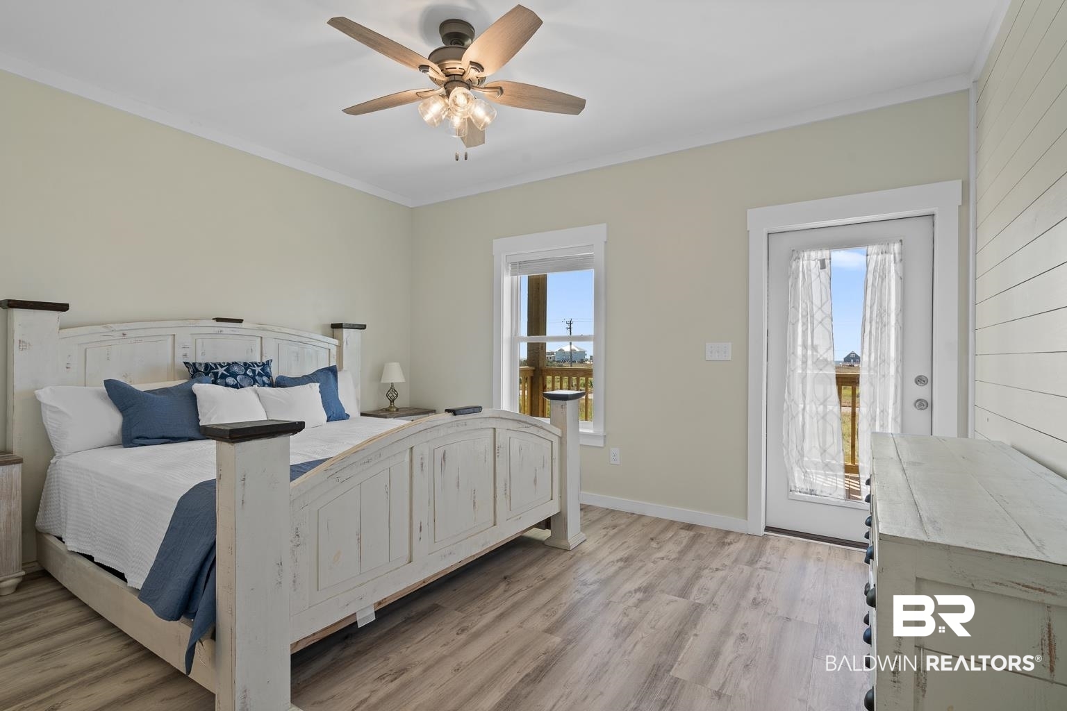 2586 Muscogee Road Gulf Shores, AL 36542 - Photo 21 of 55 Bedroom featuring light wood-type flooring, multiple windows, access to exterior, and ceiling fan