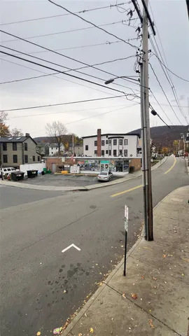 a view of a street with cars