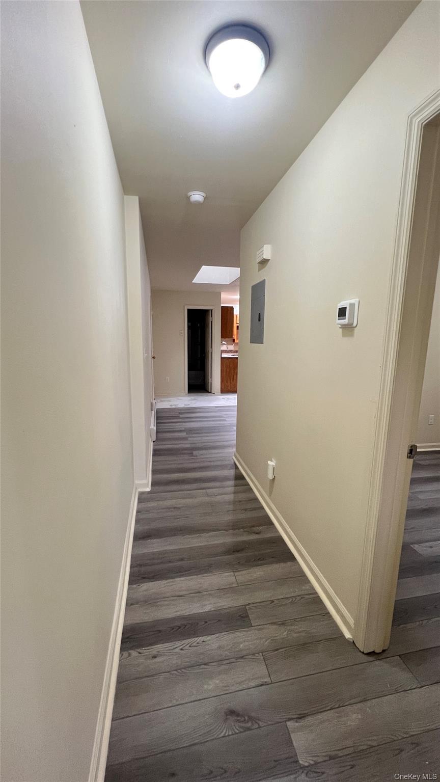 27 East Main Street, Unit 6 Beacon, NY 12508 - Photo 7 of 15 Hallway with dark wood-style floors and baseboards