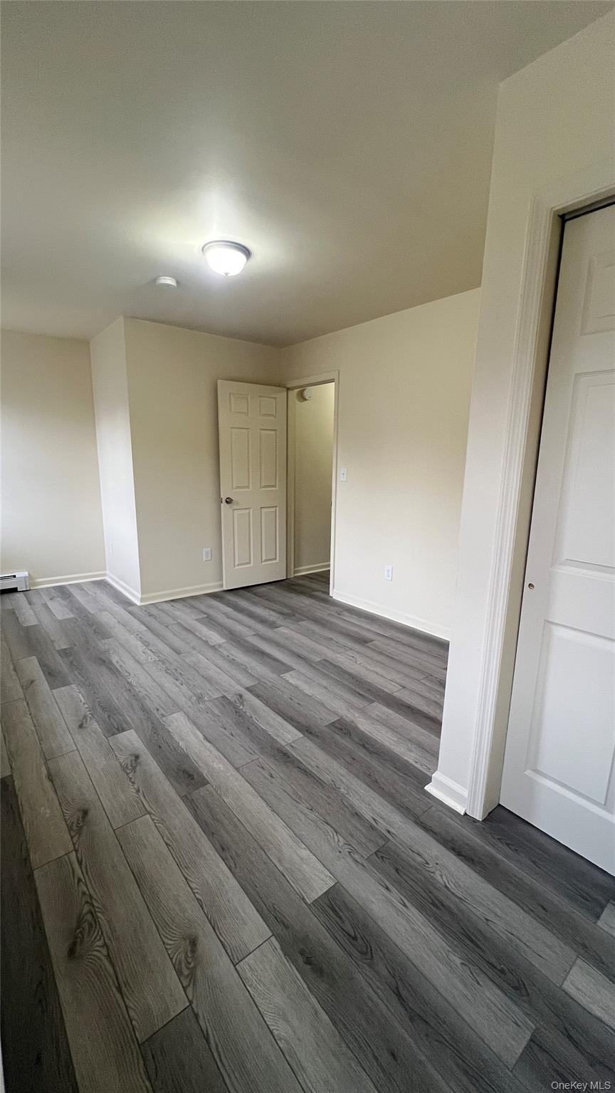 27 East Main Street, Unit 6 Beacon, NY 12508 - Photo 9 of 15 Bedroom 2 featuring wood-style floors and baseboards