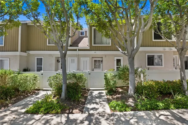 front view of a house with a garden