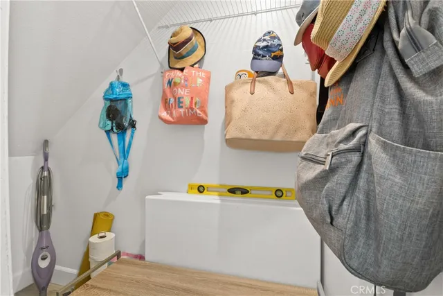 a utility room with a window and couch