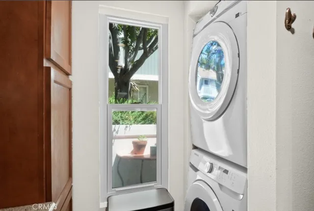 a view of a hallway with washer and dryer