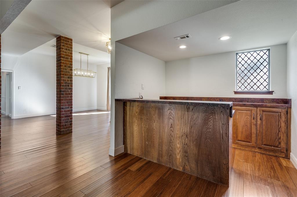 737 Newport Road Fort Worth, TX 76120 - Photo 12 of 37 Walk-in wet bar adjacent to the living room and near the dining room for easy entertaining