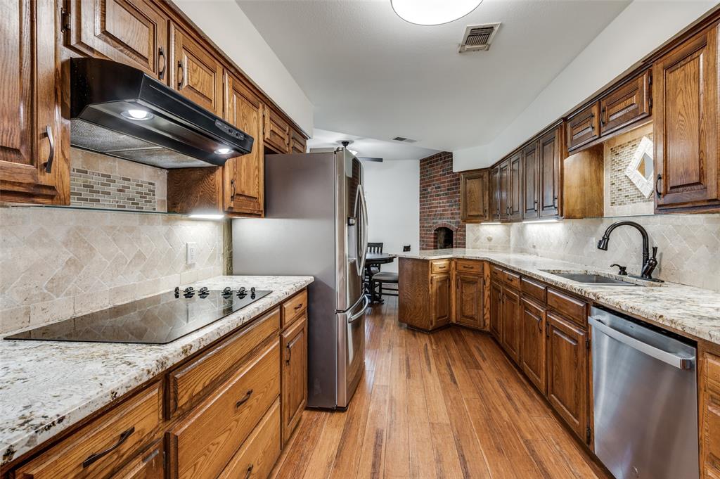 737 Newport Road Fort Worth, TX 76120 - Photo 17 of 37 Kitchen has updated GE double ovens, GE dishwasher, and Samsung refrigerator