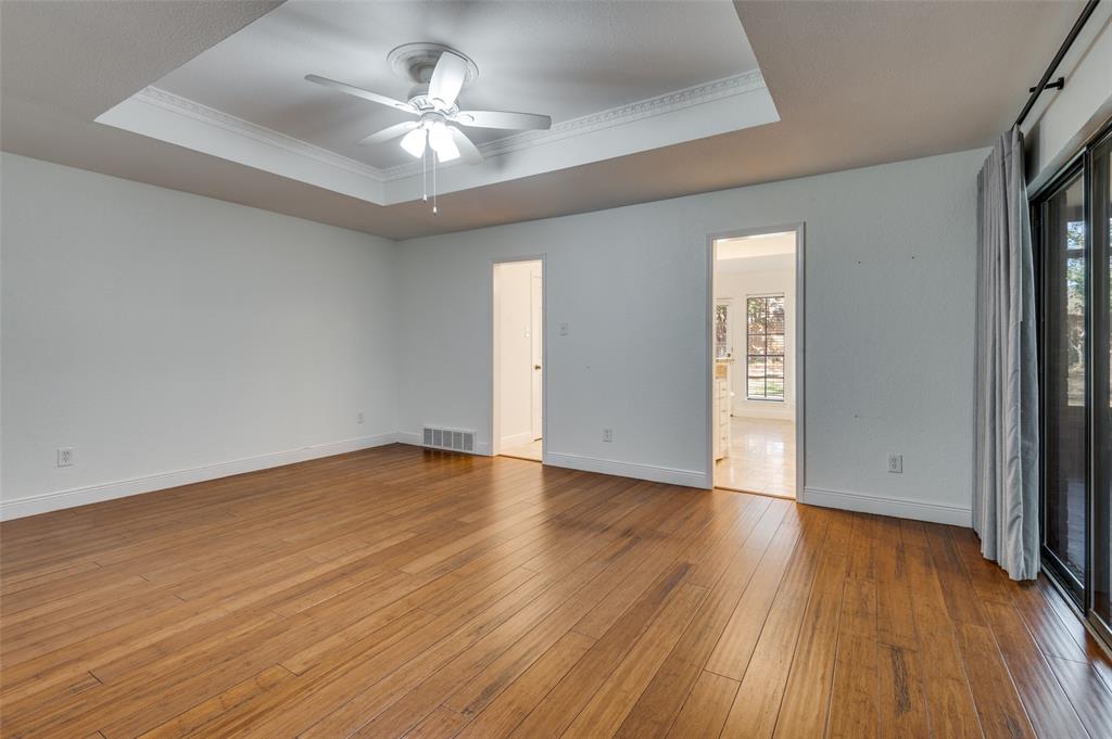 737 Newport Road Fort Worth, TX 76120 - Photo 20 of 37 Primary Bedroom with wood floors