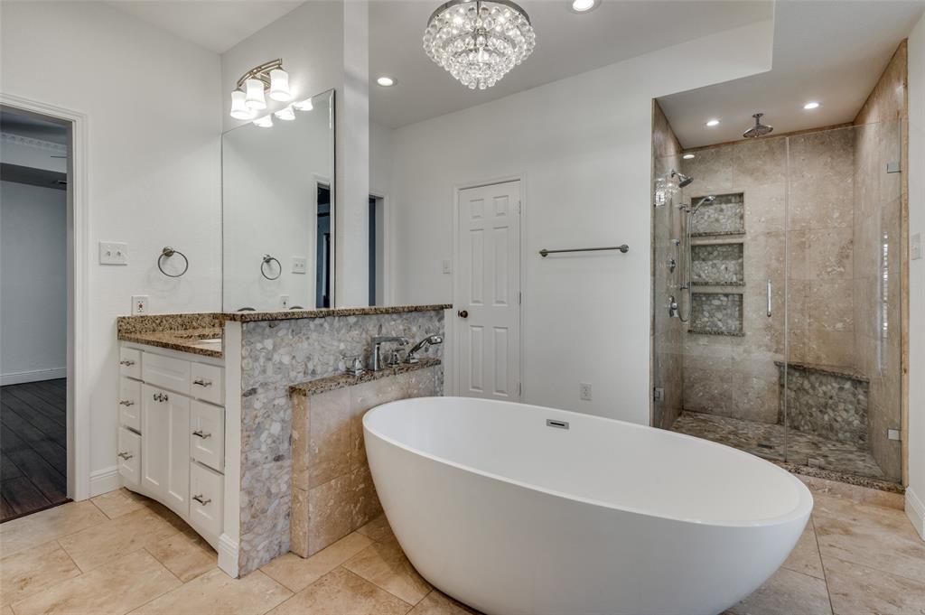 737 Newport Road Fort Worth, TX 76120 - Photo 22 of 37 Primary Bathroom with two separate vanities, soaking tub, and walk-in shower