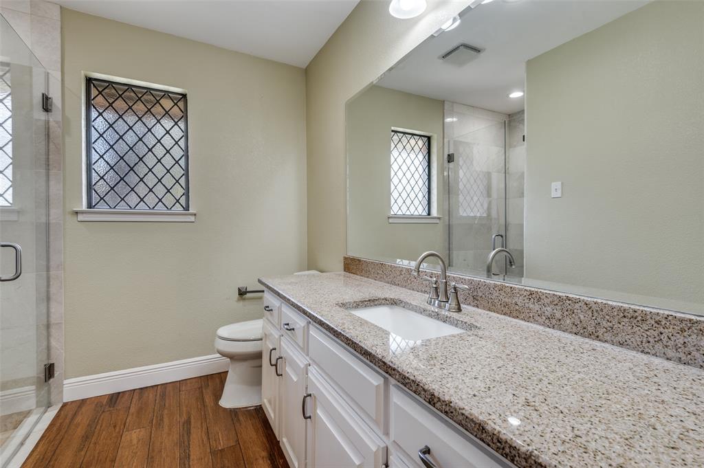 737 Newport Road Fort Worth, TX 76120 - Photo 29 of 37 Full Bathroom with walk-in shower