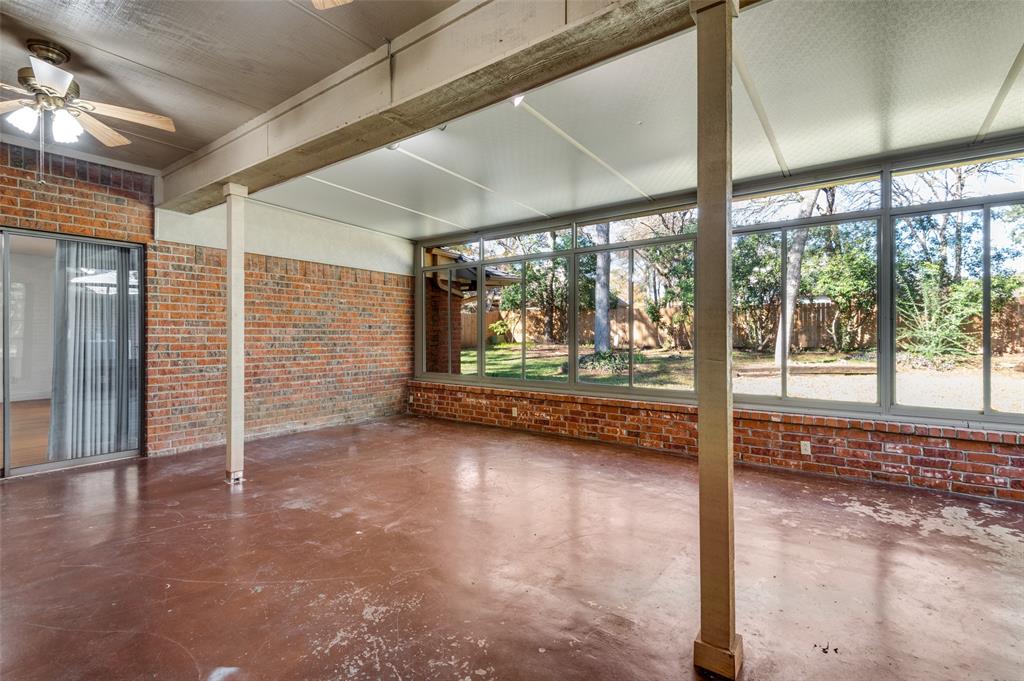 737 Newport Road Fort Worth, TX 76120 - Photo 5 of 37 Sun Room features a wall of windows over looking the back yard