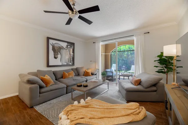 a living room with furniture and a large window