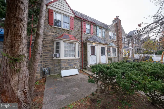 a view of a brick building next to a road