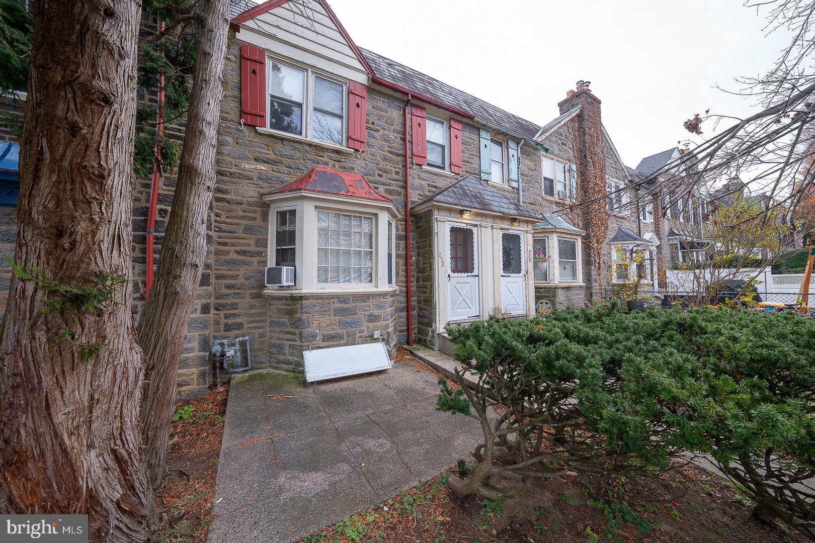 a view of a brick building next to a road