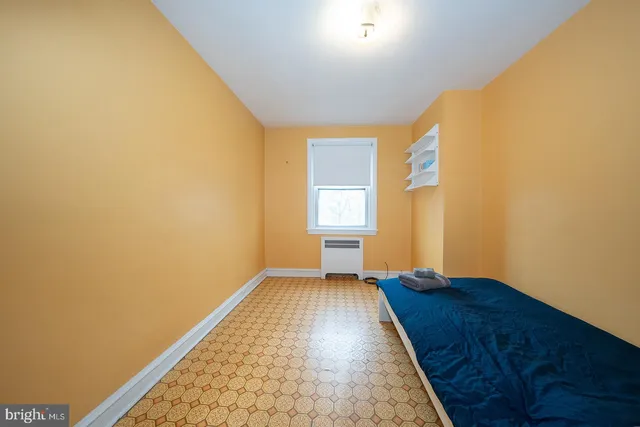 a view of a room with wooden floor and small space