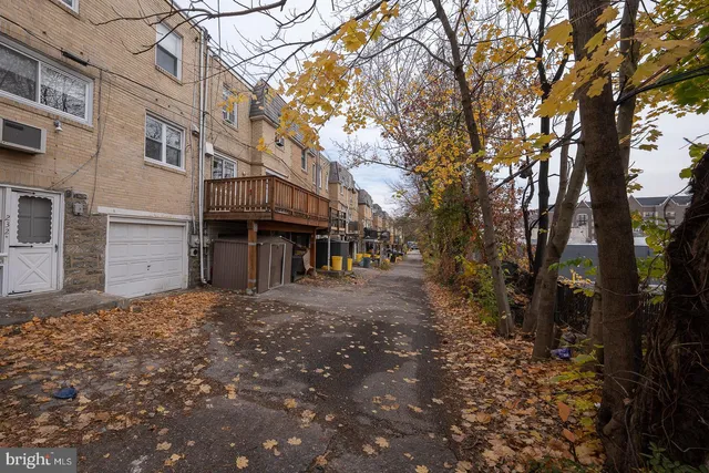 a view of street with large trees