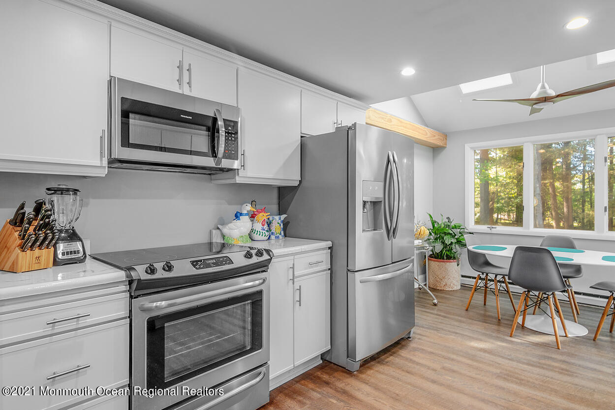 308 New Road Montague, NJ 07827 - Photo 5 of 27 a kitchen with stainless steel appliances a stove a sink and a refrigerator