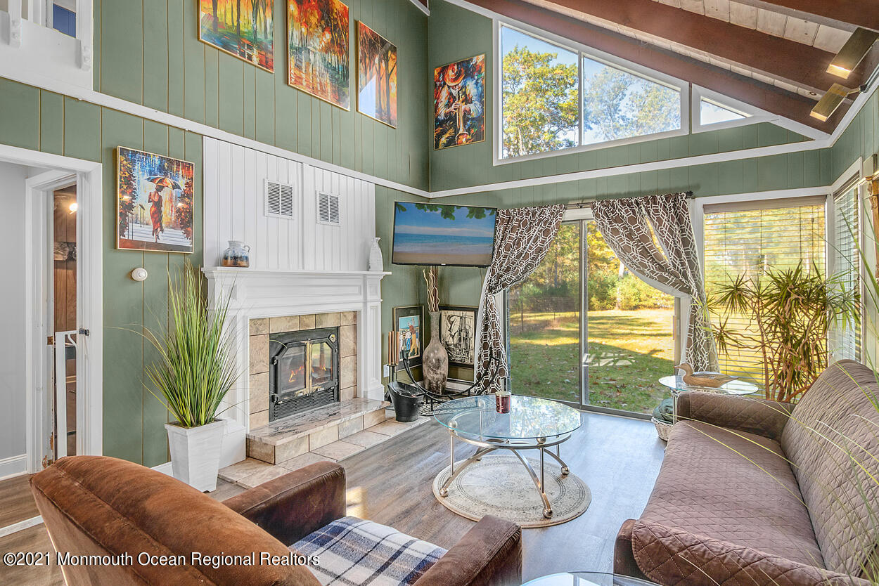 308 New Road Montague, NJ 07827 - Photo 10 of 27 a living room with furniture a fireplace and a large window
